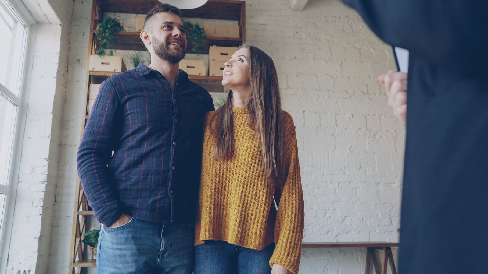 Home buyers exploring a property
